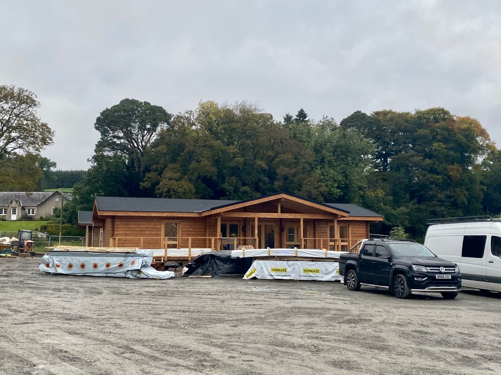 Long timber cafe building nearing completion on the site.