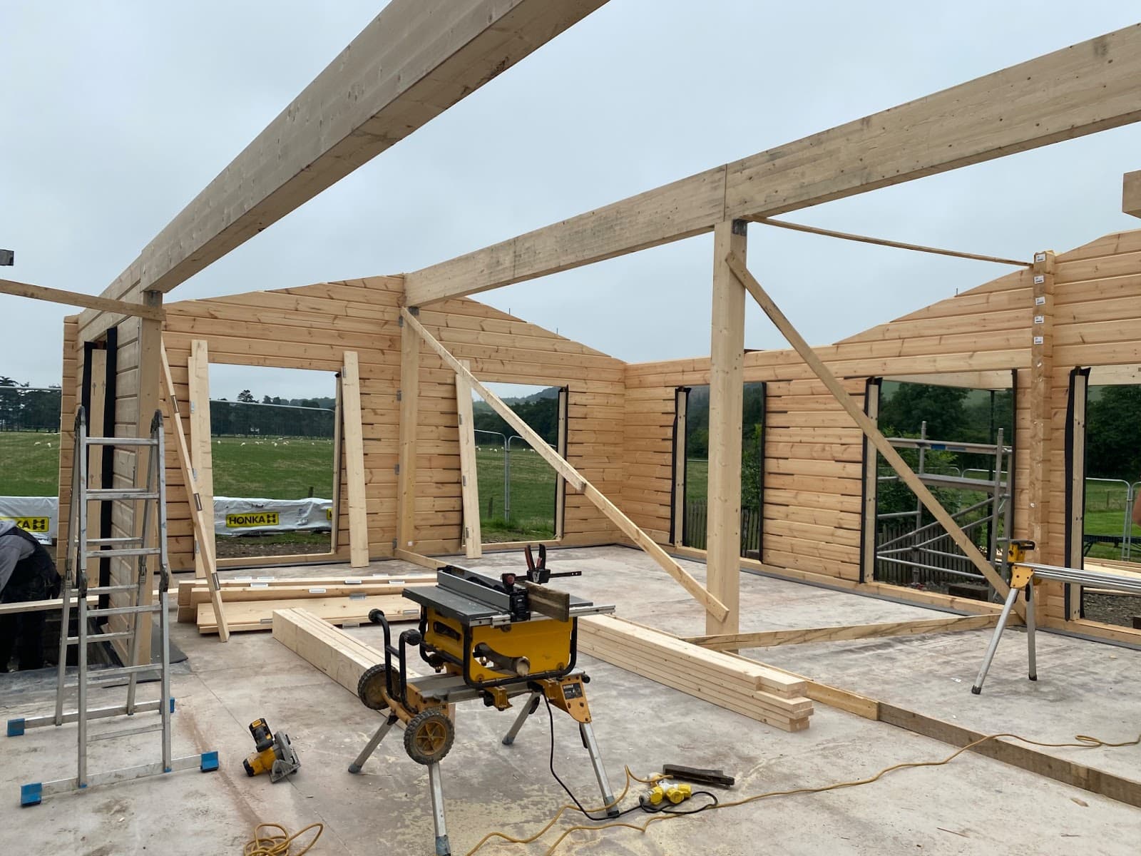 Timber cafe walls and open roof frame during construction.